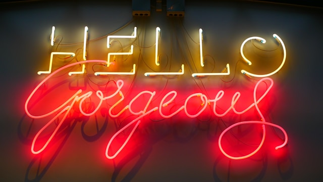 Neon sign that says, "Hello Gorgeous"